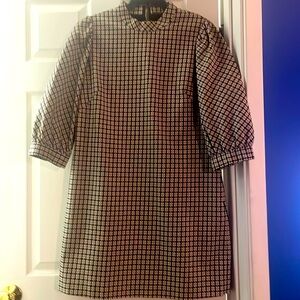 High neck Mini dress with puff sleeves.